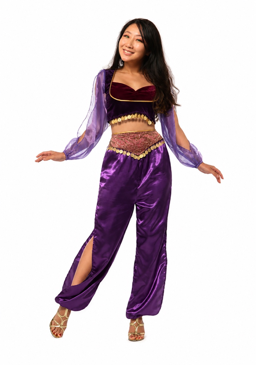 Anni Bulla, professional belly dancer in Liverpool, smiling in a bright purple costume